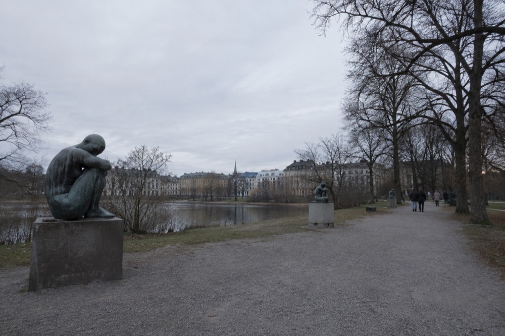 Sculptures along a gravel path in a large Oslo park