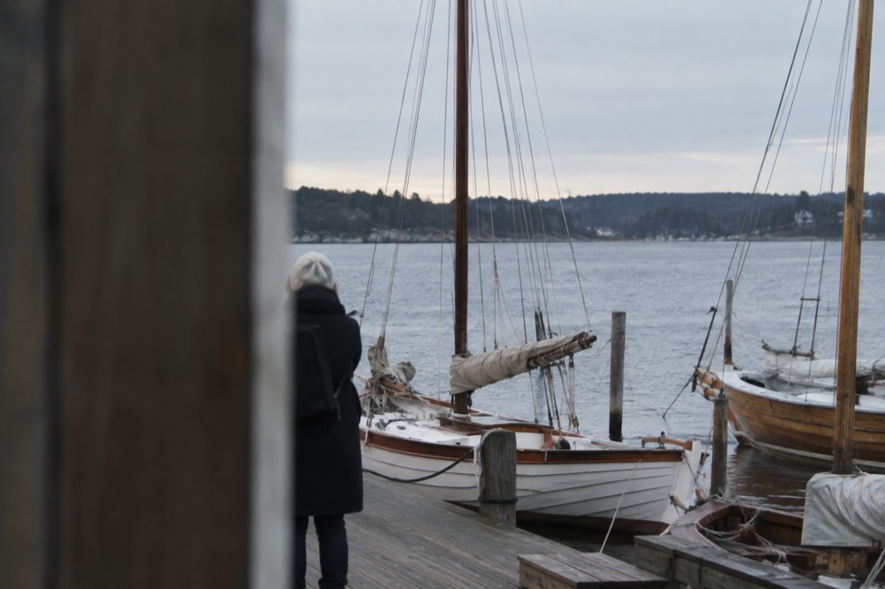 Bygdøy museum peninsula waterfront with wooden boats moored at a pier