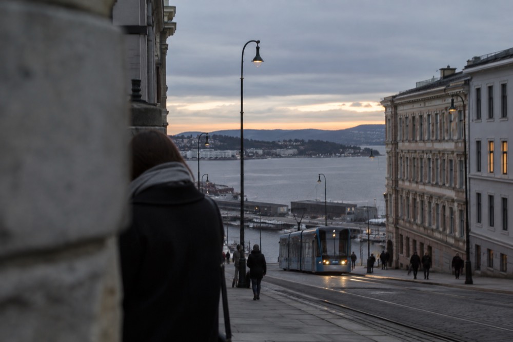Oslo city skyline seen across the Oslofjord at dusk