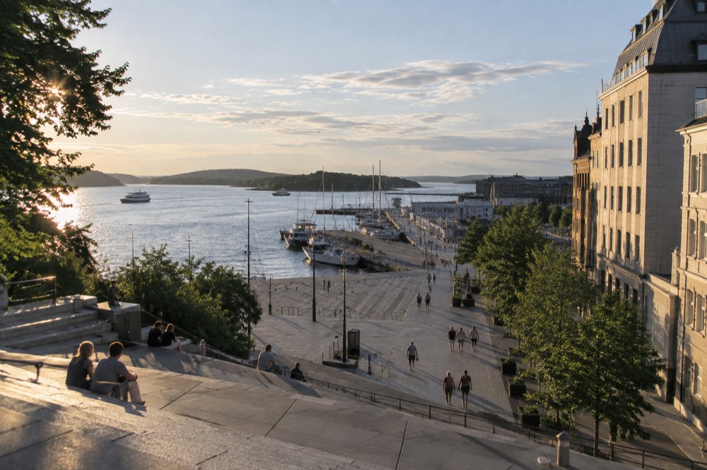Oslo fjord waterfront under a bright summer sky with moored boats