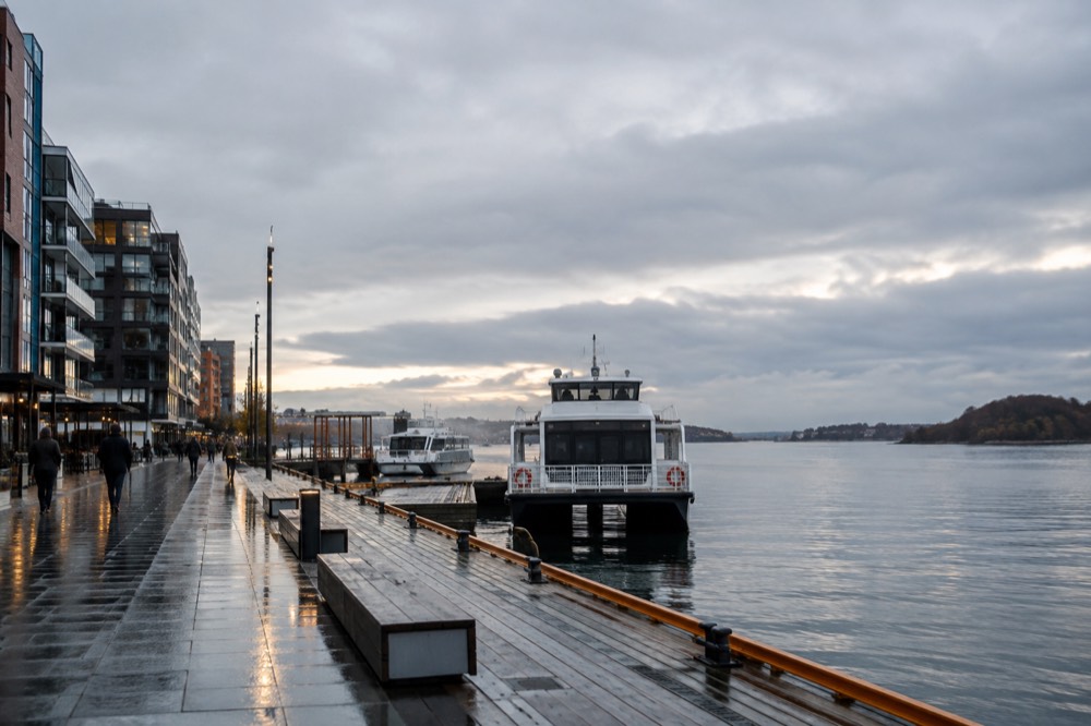 Ferry dock at Aker Brygge under low grey November clouds