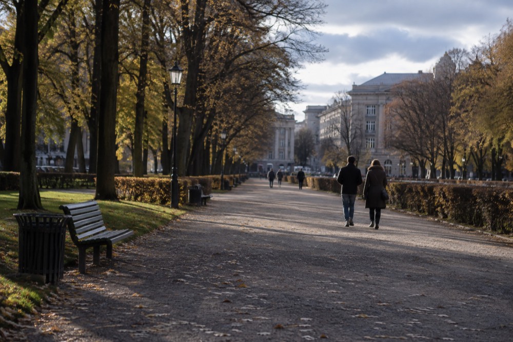 A formal park axis in Oslo with clipped lawns, a long gravel avenue and trees on both sides