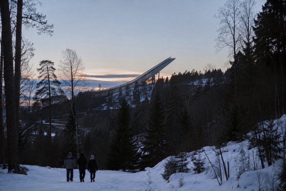 Ski jump tower above forested hills at Holmenkollen