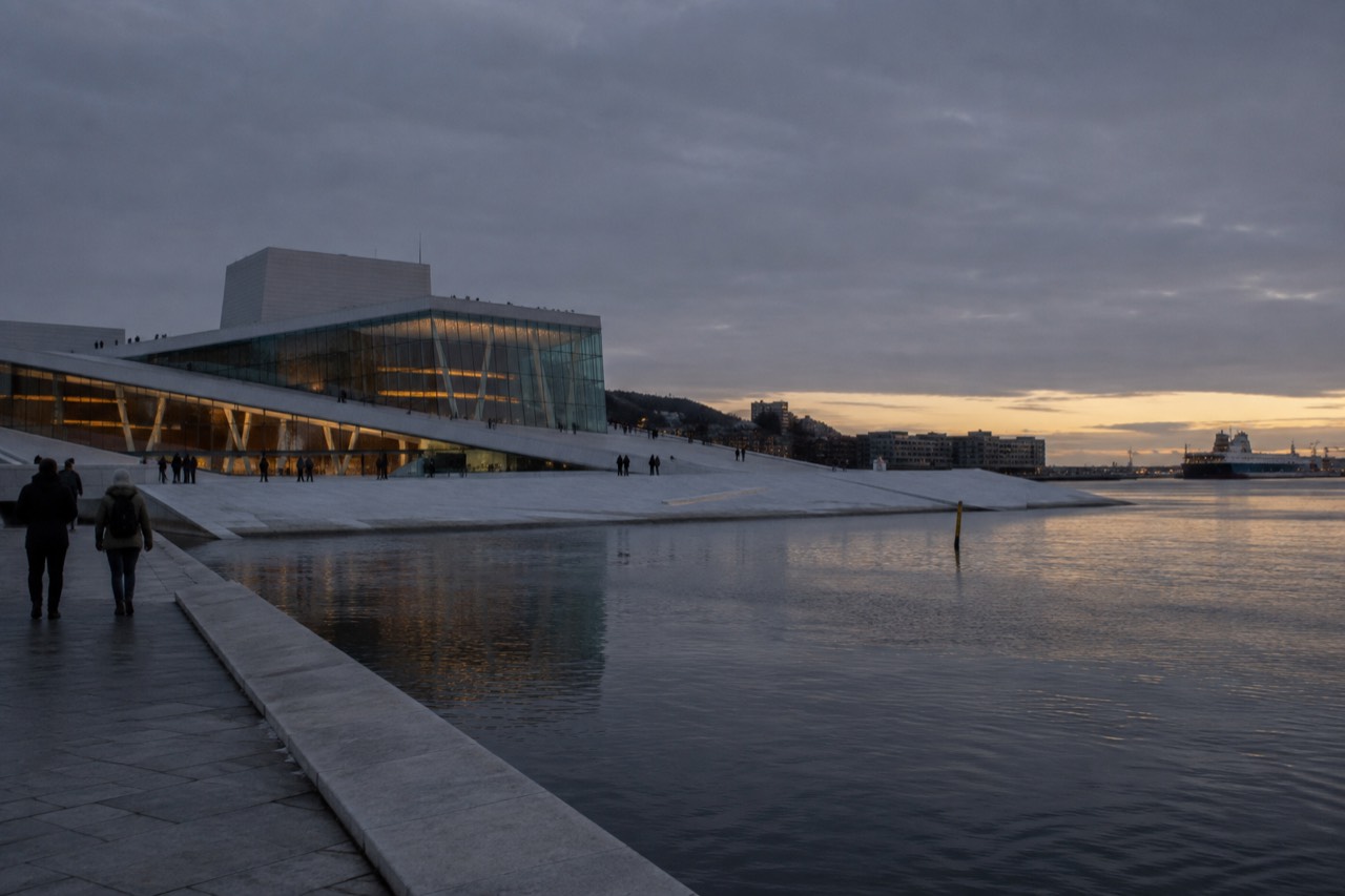 Oslo waterfront with the opera house and fjord at dusk