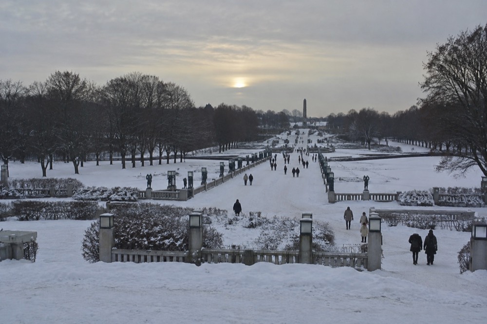 Snow covering the sculptures and pathways of Vigeland Park in winter