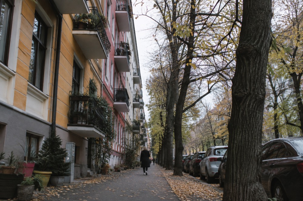 Colorful old apartment buildings along a tree-lined Grünerløkka street in Oslo