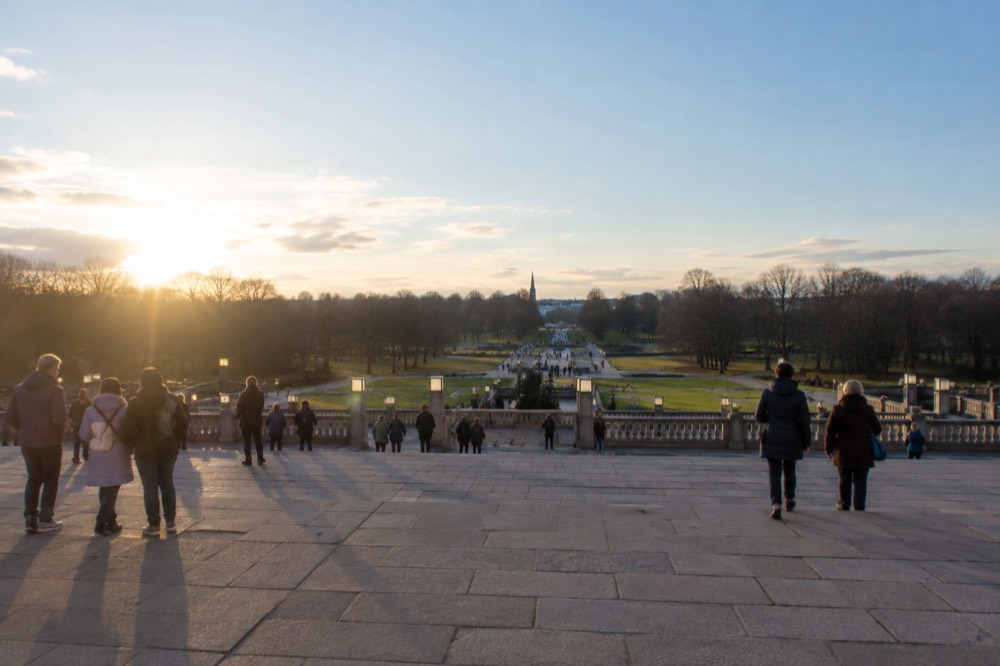 Visitors gathered on the open stone terraces of Vigeland Park in daylight