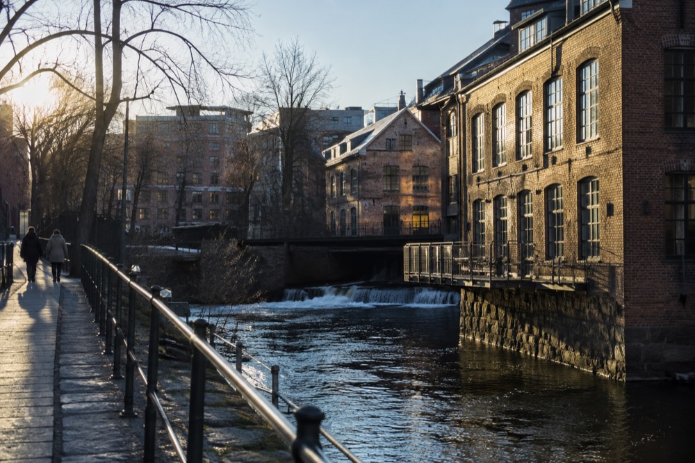 Row of historic brick warehouses along the Akerselva river in central Oslo
