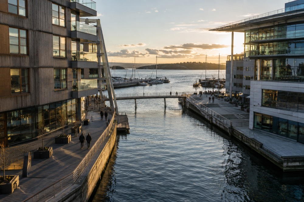 Modern waterfront buildings and a canal at Tjuvholmen in Oslo