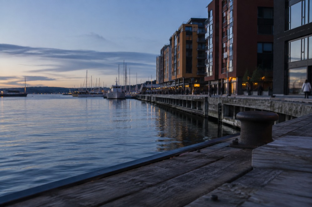Colorful warehouse buildings along the Oslofjord waterfront at Aker Brygge