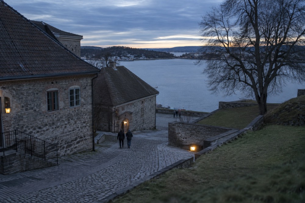 Exhibition hall inside a fortress museum with wartime photographs and display cases