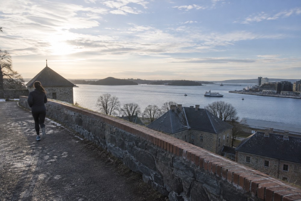 Wide view from fortress ramparts over the inner harbor, fjord islands and city skyline