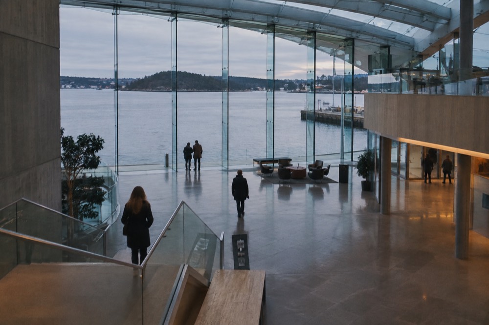 Museum lobby with a water view through floor-to-ceiling glass