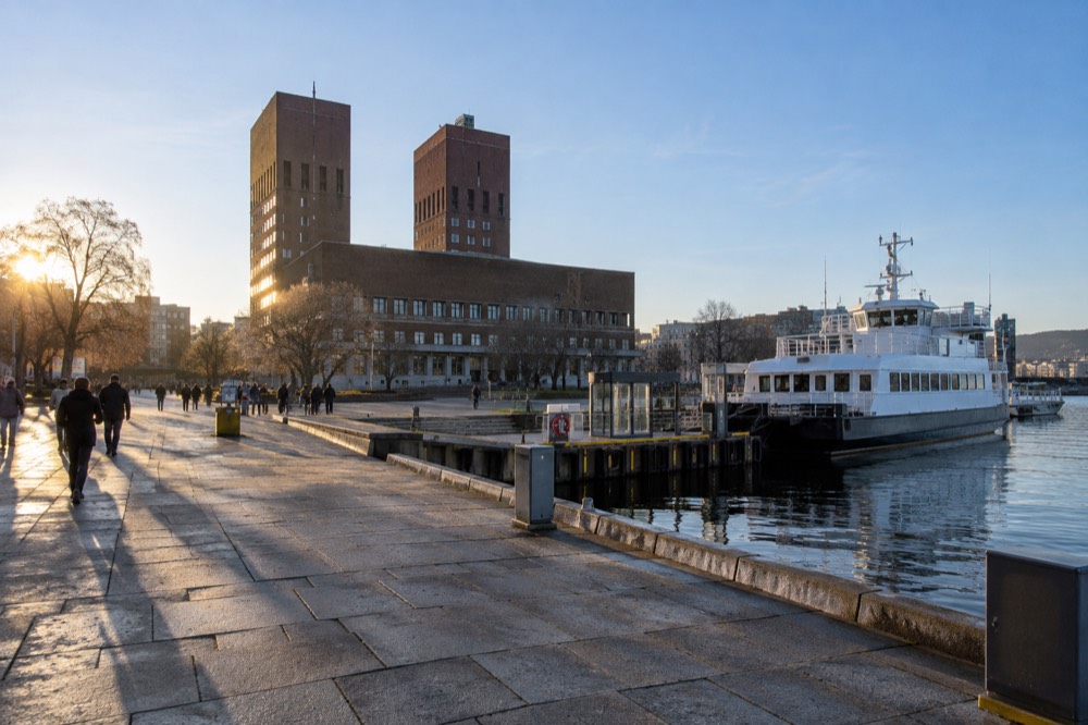The City Hall pier at Rådhusbrygge 3 with a white passenger ferry at the dock