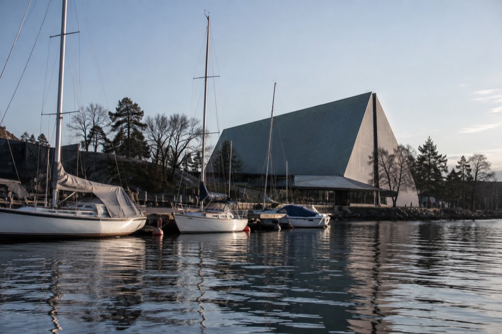 The Kon-Tiki Museum facade at Bygdøynes with moored boats in the foreground