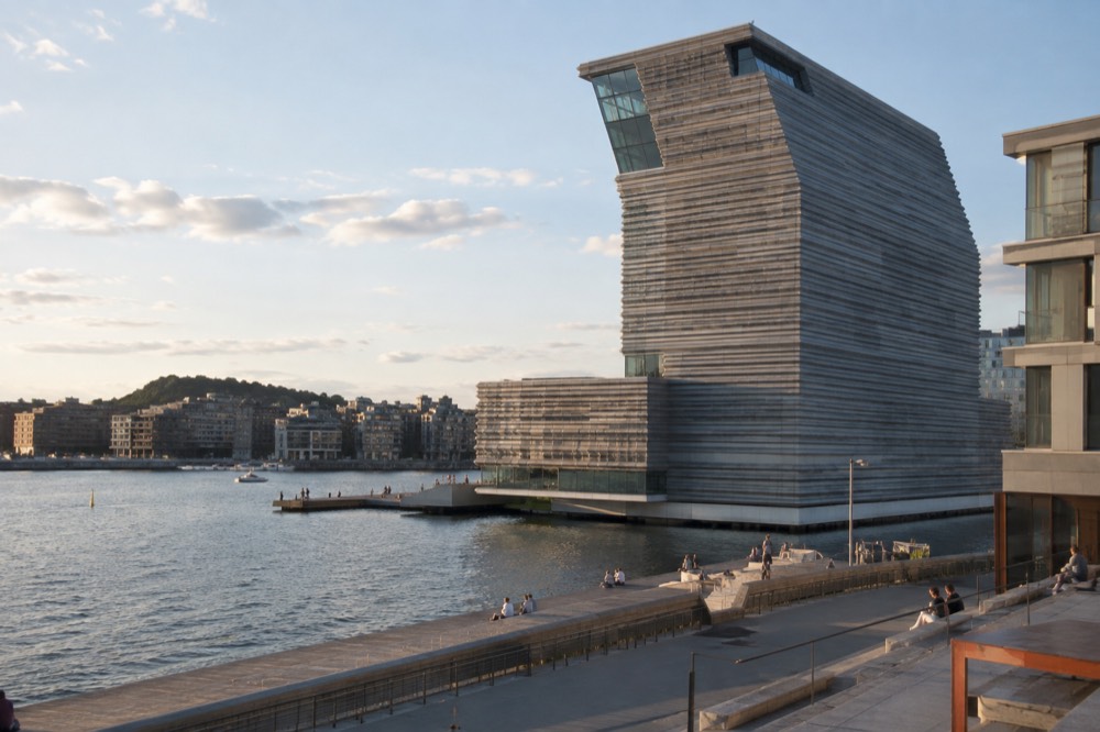 The striped facade of the MUNCH museum rising above the Oslofjord