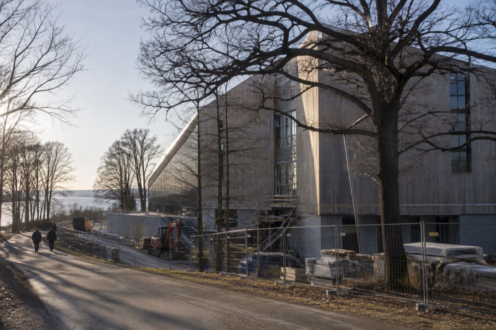 The exterior of the new Museum of the Viking Age building under construction beside trees on Bygdøy