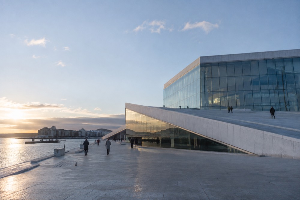 Museum gallery with skylight and long view down a corridor of artworks
