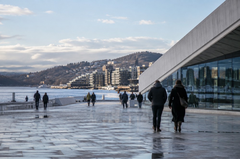 Waterfront promenade in Oslo with modern buildings along the fjord