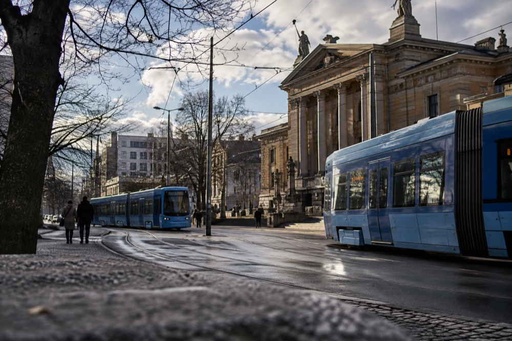 Trams crossing the street near the National Theatre station in central Oslo
