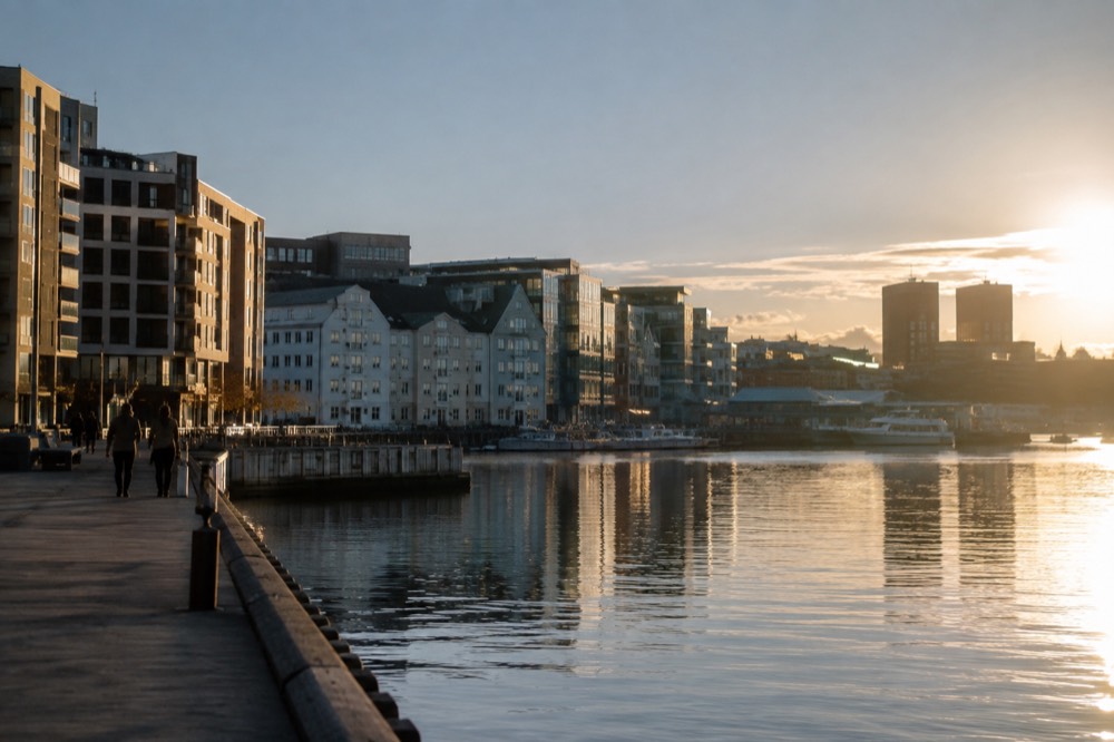 Evening light on the Oslo waterfront with the city skyline reflected in the fjord