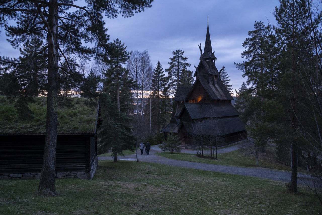 Wooden stave church standing among trees at an open-air museum in Oslo