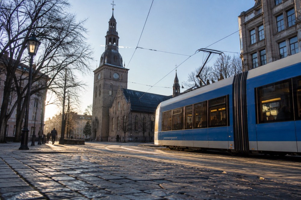 Tram passing Stortorvet square in front of Oslo Cathedral