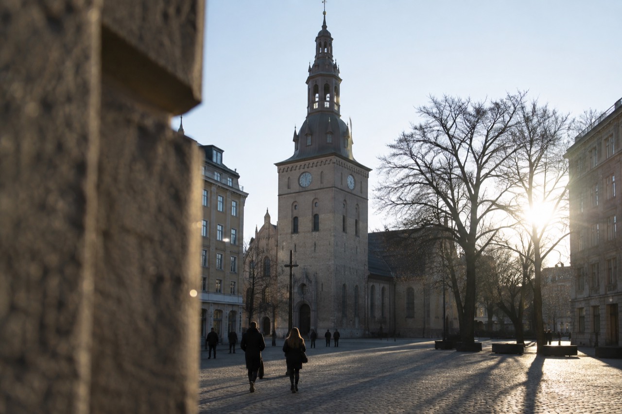 Oslo Cathedral seen from Stortorvet square with its tower against the sky