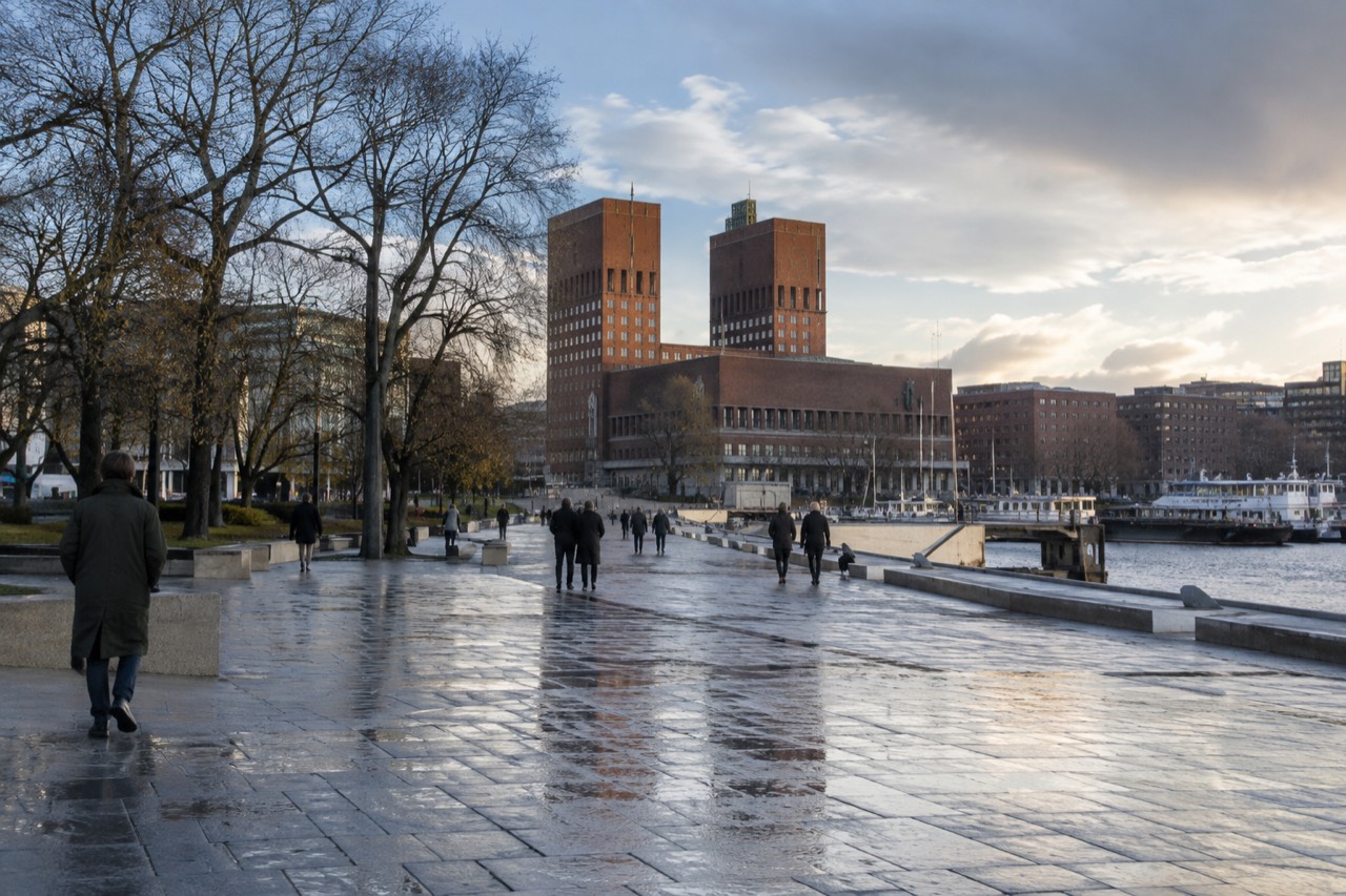 Oslo City Hall brick towers rising above the waterfront and fjord