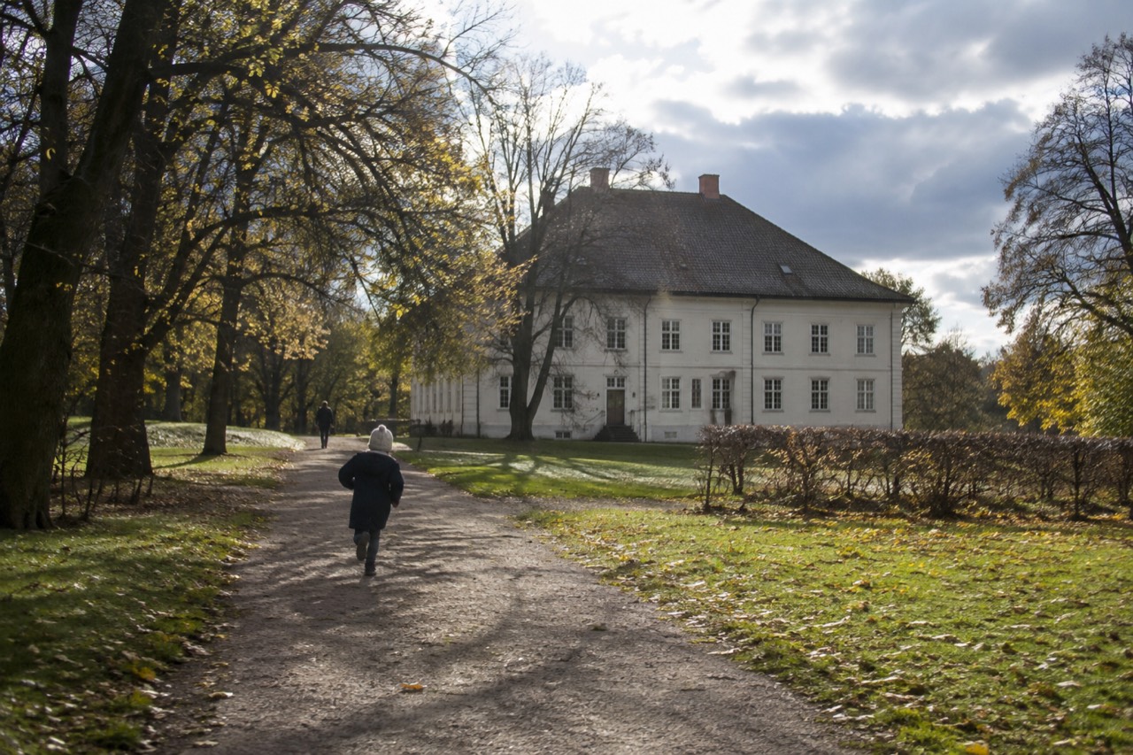 Historic manor building surrounded by trees in a park in Oslo