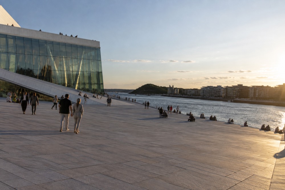 Wide marble steps of the Opera House roof rising gently from the waterfront plaza