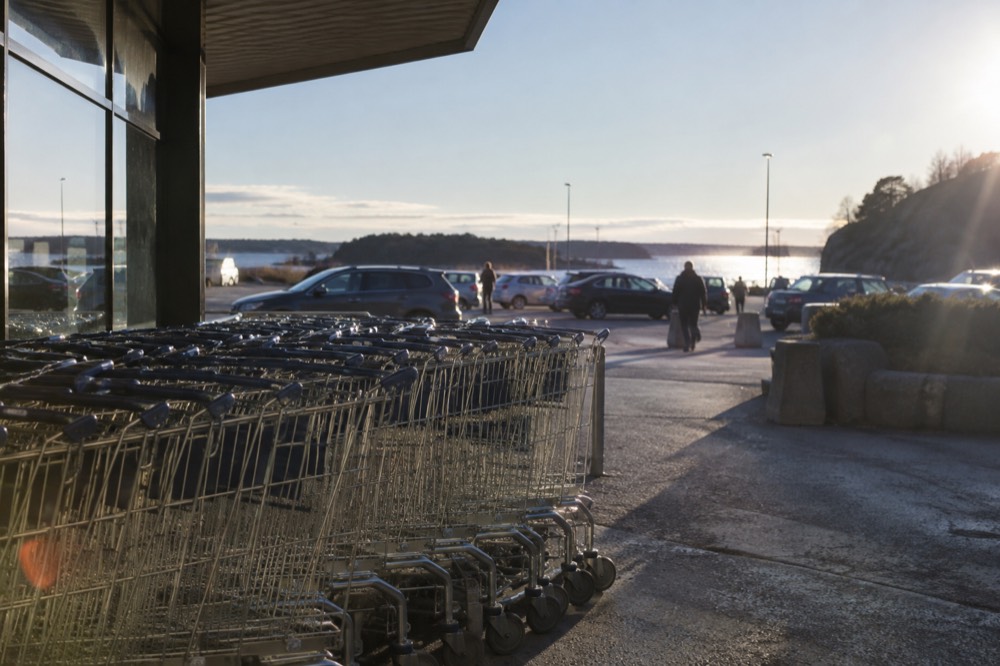 Shopping carts lined up outside a large border shopping center in Sweden