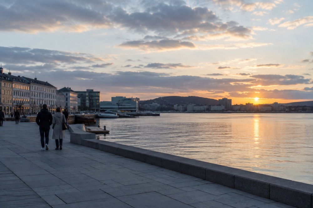 Oslo city skyline seen across the Oslofjord at dusk