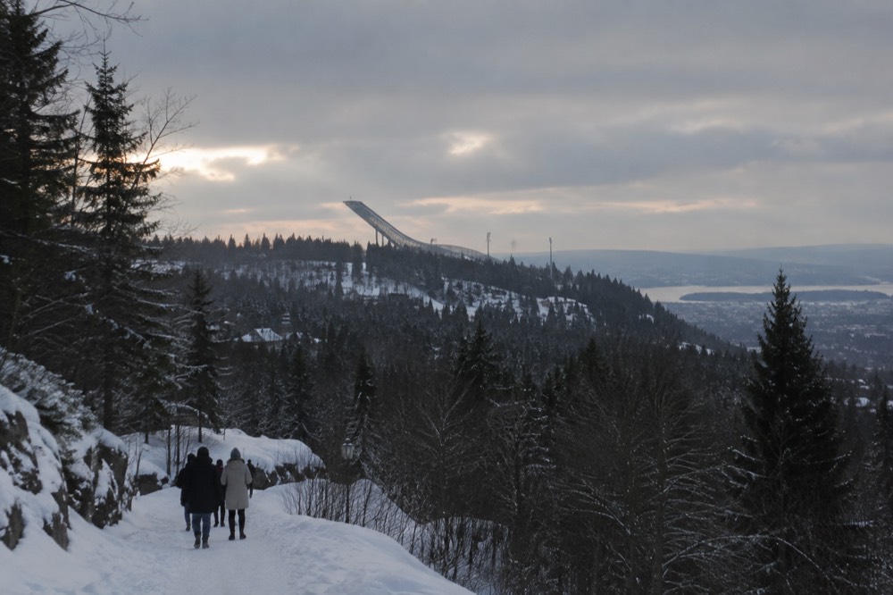 The Holmenkollen ski jump tower rising above the forest on the Oslo skyline