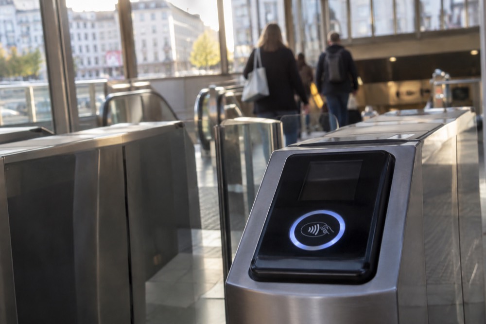 A contactless payment terminal at a metro gate in Oslo