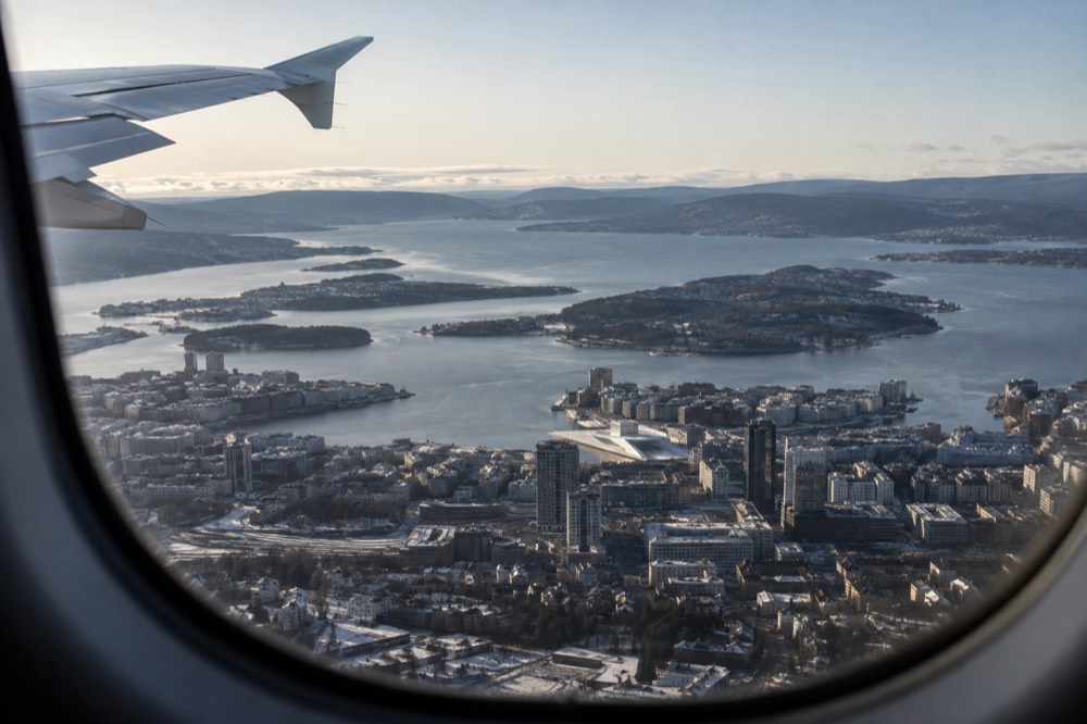View of Oslo city skyline and fjord from an airplane window on approach