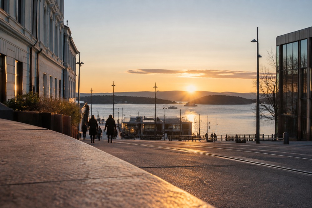 Sunset light over the Oslofjord with forested islands in the distance