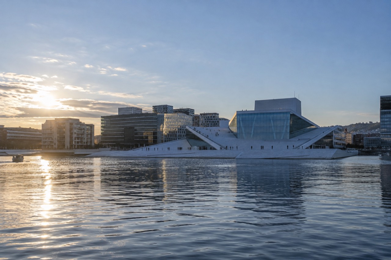 View across the Oslofjord to the Opera House and city skyline on a clear evening
