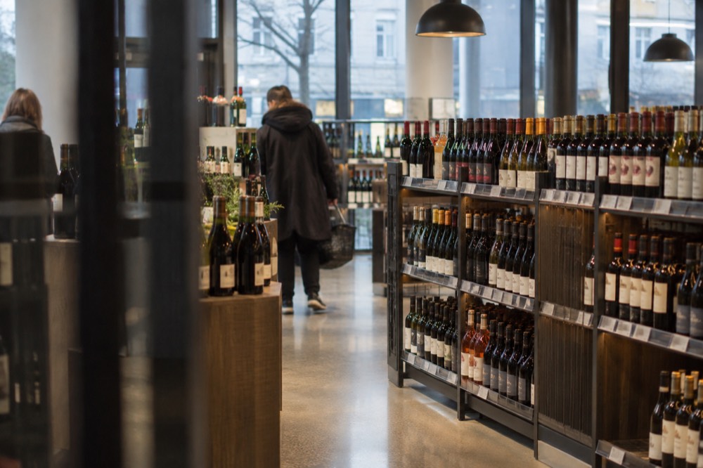 Interior of a Vinmonopolet shop with shelves of wine bottles