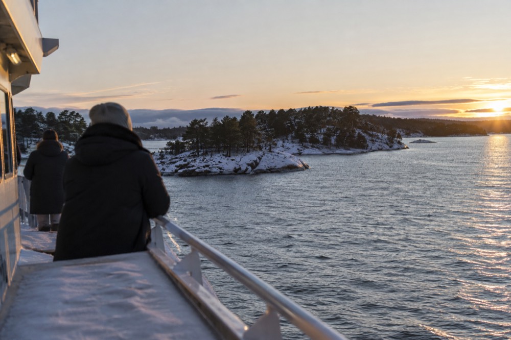Fjord islands under low winter light seen from a ferry deck