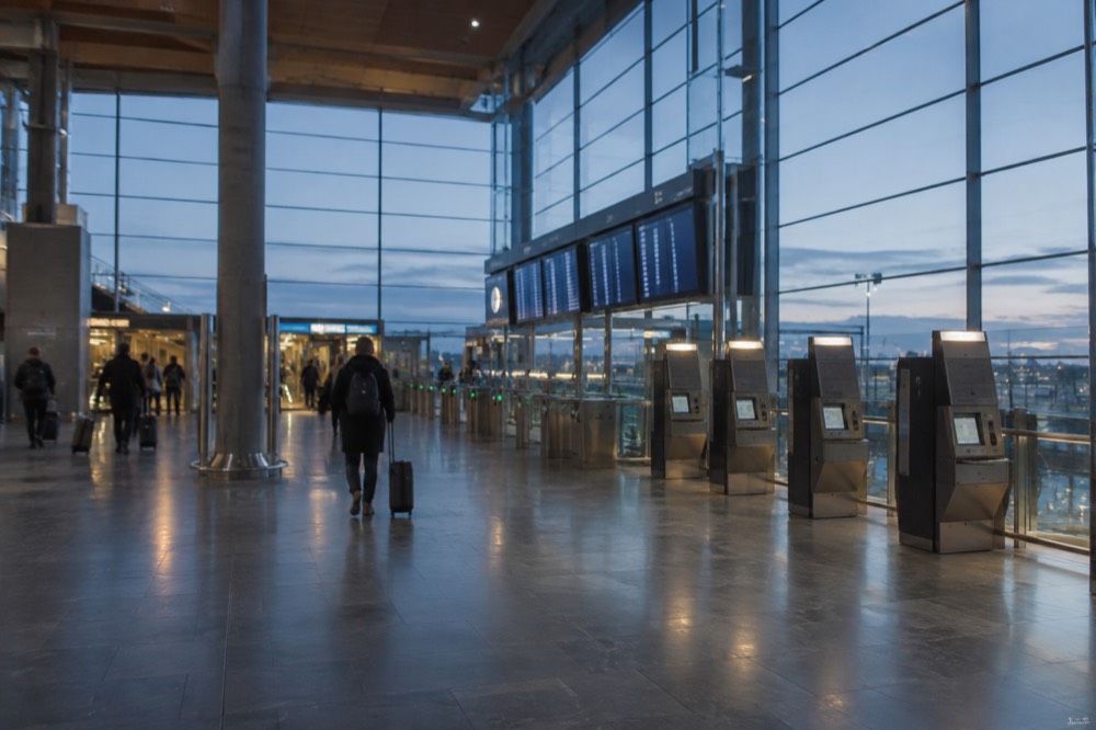 Ticket machines and information screens in an airport railway concourse