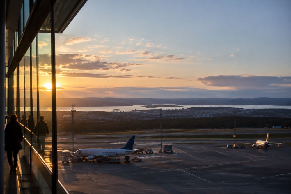 Evening view over Oslo city rooftops with the fjord in the distance