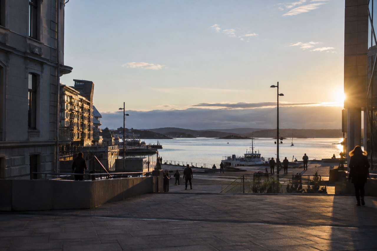 Oslo city skyline seen across the Oslofjord on a calm evening
