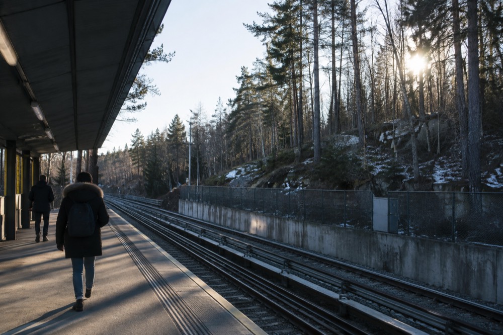Metro platform at a forested terminus station in the hills above Oslo