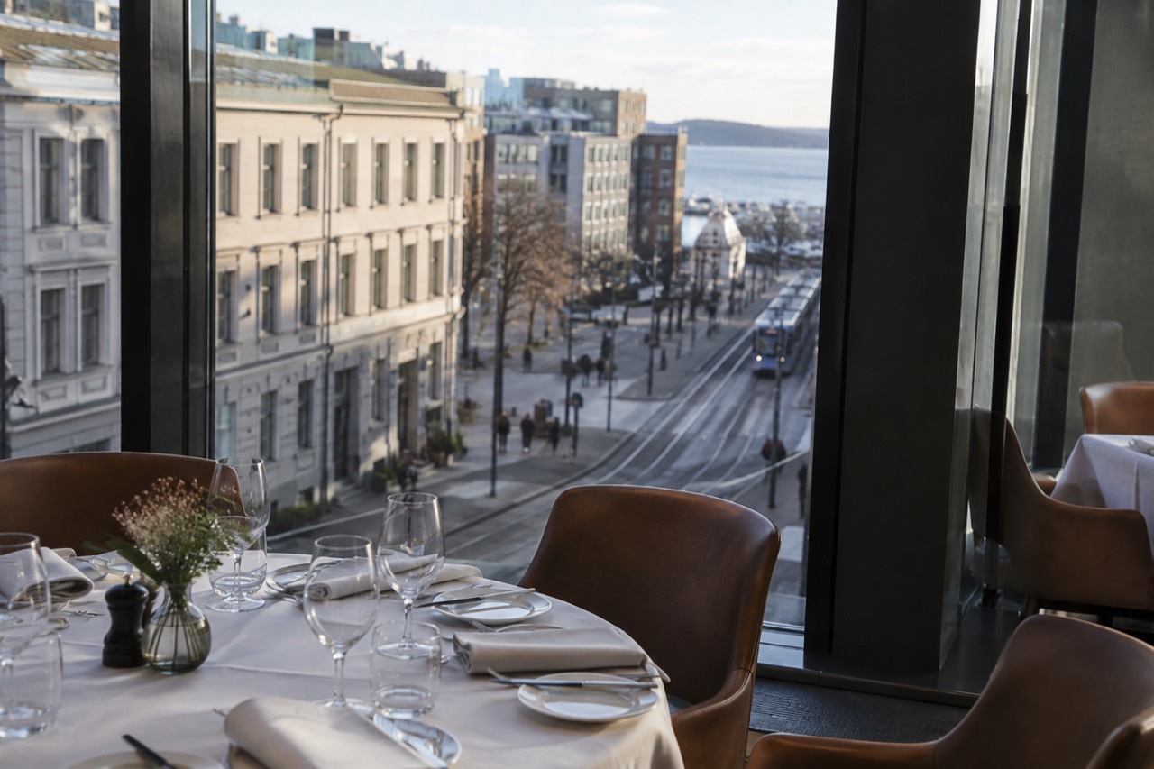 Set table with linen napkins and wine glasses in an upscale Oslo restaurant