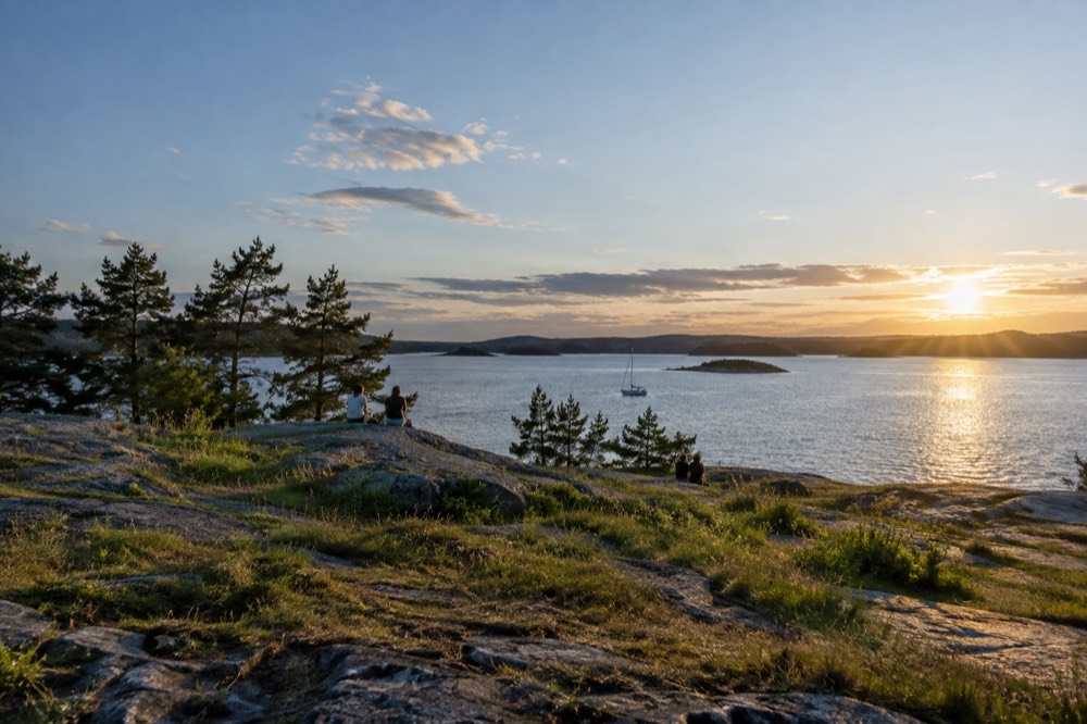 Sun low over the Oslofjord islands on a bright summer evening