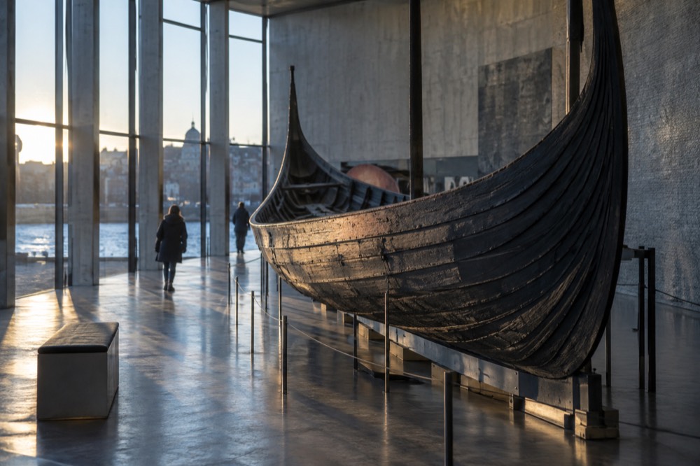 Wooden viking age ship hull inside a museum hall