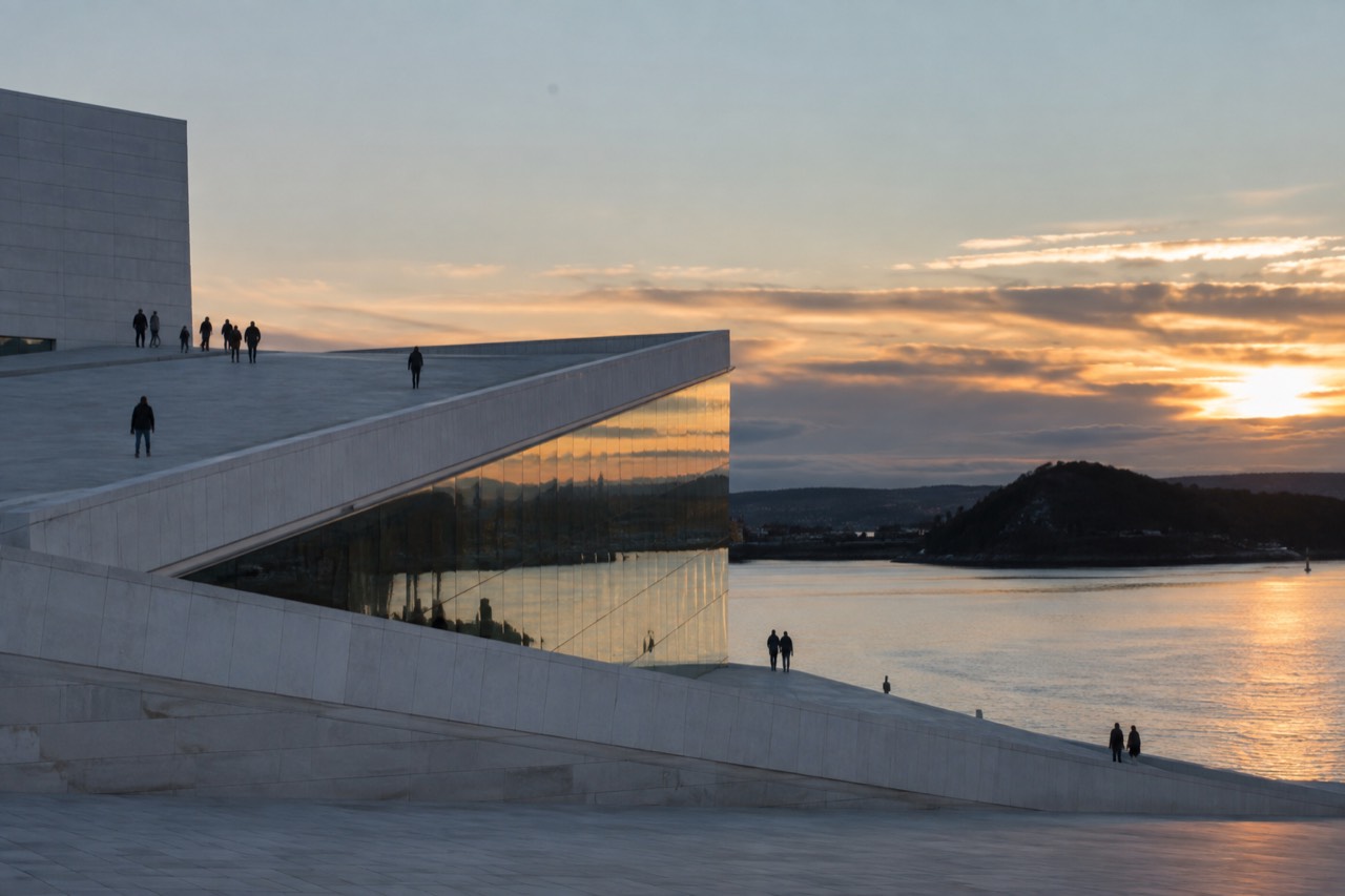 Oslo Opera House angular white marble roof above the Oslofjord at dusk