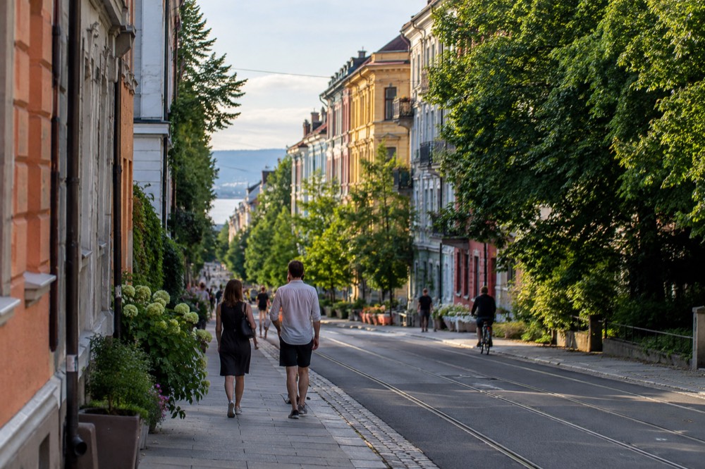 Colorful apartment buildings in a lively city district on a summer evening