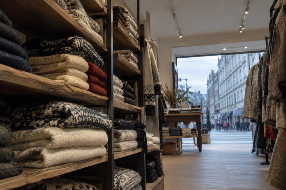 Shelves of Norwegian wool sweaters and knitwear in a boutique